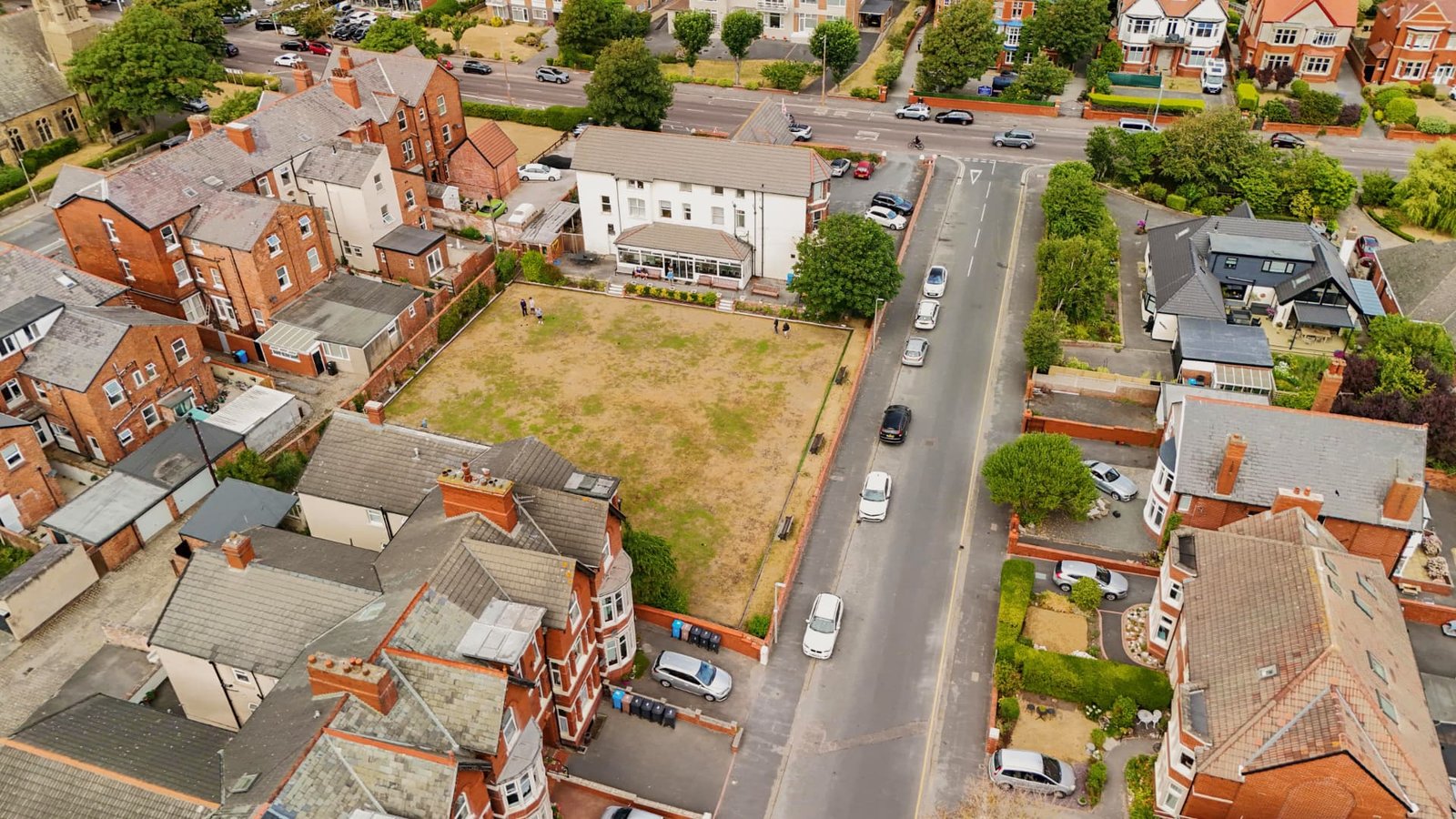 The District Club and its bowling green from the air, with the rooftops of St Annes beyond.
