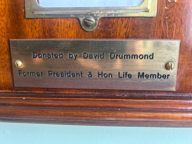Brass plate reading Donated by Syd Drummond, Former President and Hon Life Member