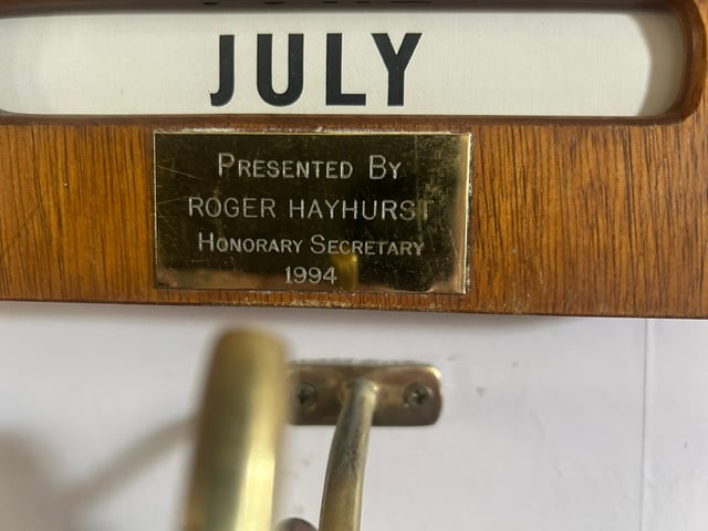 Brass plate reading Presented by Roger Hayhurst, Honorary Secretary 1994