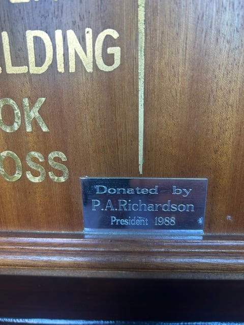 Brass plate on an honours board reading Donated by P. A. Richardson, President 1988