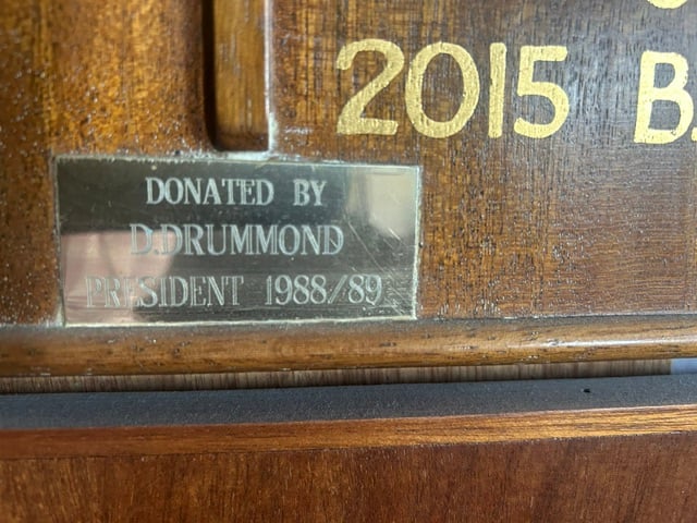 Brass plate on an honours board reading Donated by D. Drummond, President 1988/89