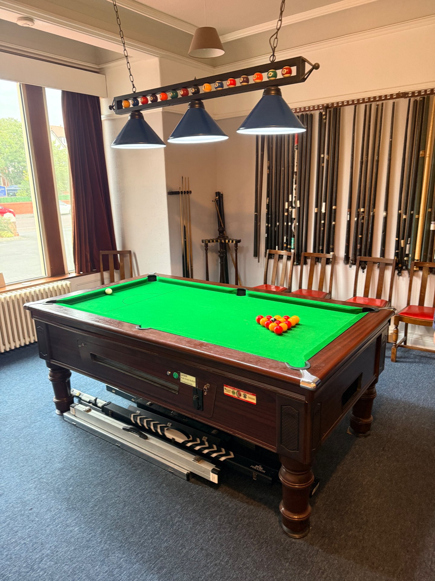 The pool table set for a fresh break in the games room.